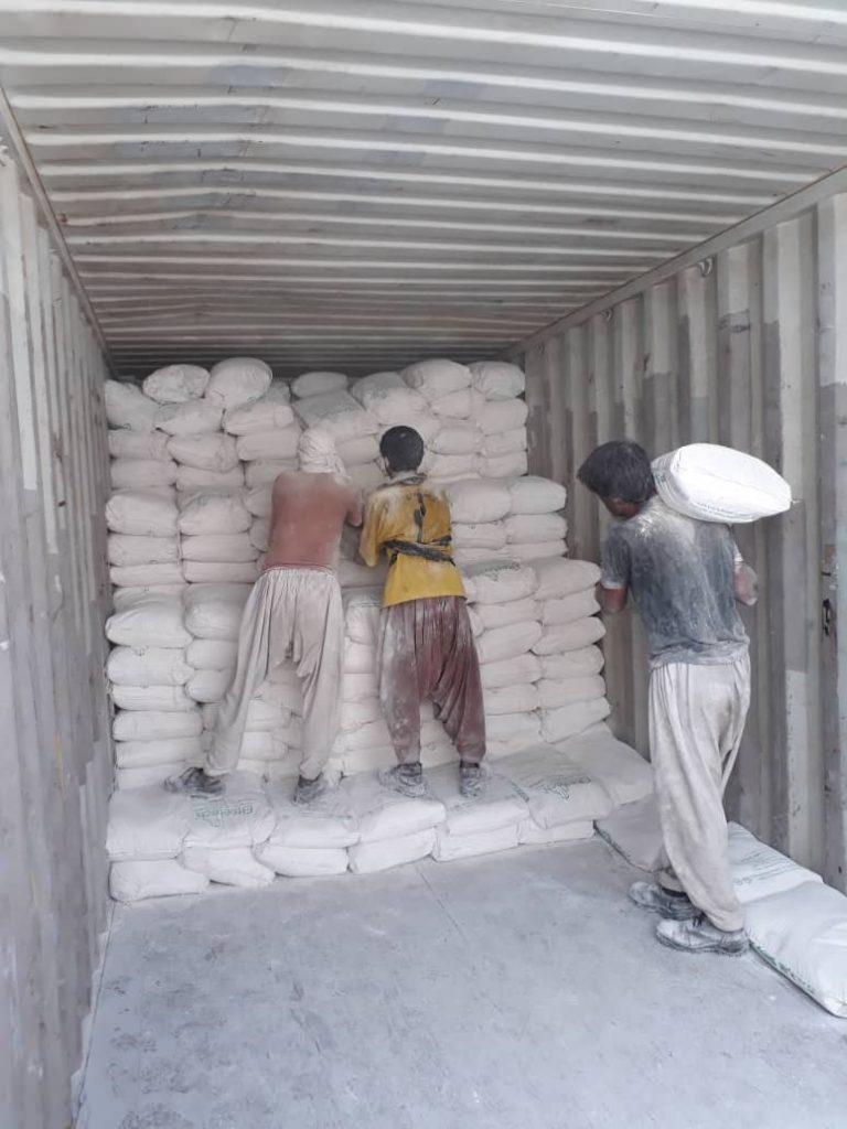 Workers unloading Gypsum